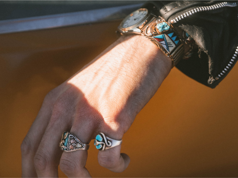 image of a woman wearing two rings from our jewlery collection