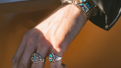 image of a woman wearing two rings from our jewlery collection