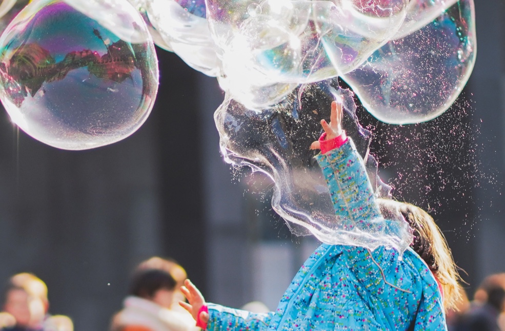 Children playing with bubbles.